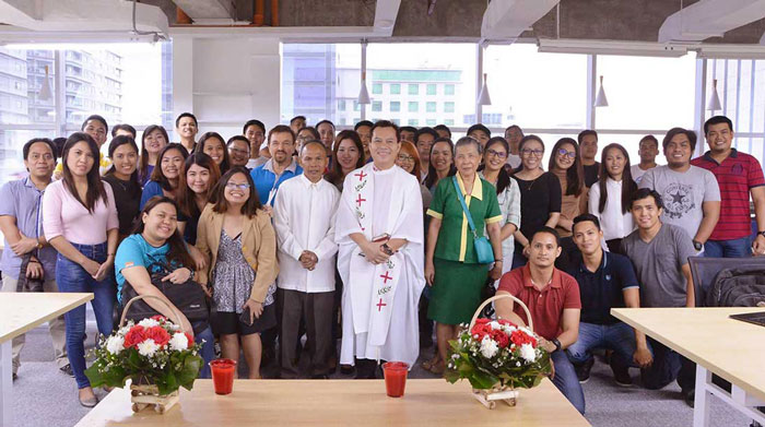 Team portrait during our office blessing. Admin, staffs, project managers, analysts, developers, programmers, QAs, technical writers, and SEO specialists gathered together.
